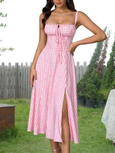 Detail of pink and white plaid midi dress with bow tie neckline and high slit design