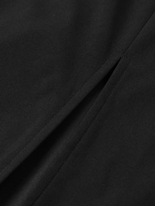 Detail of high-quality black woven fabric showing neat stitching and side slit texture