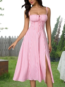 Detailed close-up of pink gingham dress featuring front drawstring tie and side slit detail