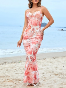 Close-up of mesh maxi dress featuring ocean coral prints and bodycon fishtail hemline