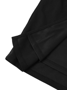 Close-up of double-stitched hem and fine knit fabric texture on a black strapless dress
