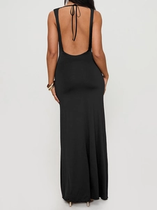Detail of elegant U-shaped open back and halter neck tie on a sleek black maxi dress