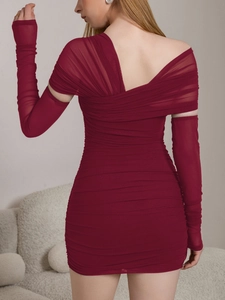 Detailed view of burgundy ruched mesh dress featuring backless cross design and long gloves