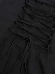 Detailed view of the black lace-up corset tie design on the fishbone floral maxi dress