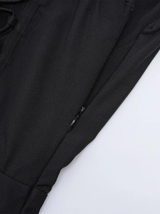 Detail of the high-quality invisible zipper on a black fishtone slit maxi dress