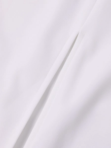 Close-up of side slit stitching and soft white chiffon fabric texture on a long dress