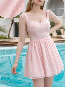 Detail of light pink floral jacquard fabric with three buttons on sweetheart neckline