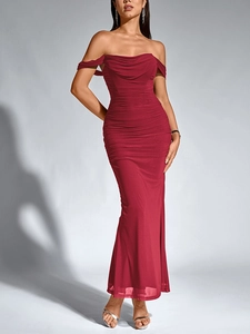 Detail of elegant dark red mesh dress with off-shoulder neckline and pleated textures