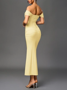 Close-up of ruched back detail on light yellow bodycon off-shoulder mermaid dress