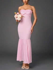 Detail of pink strapless fisheye dress with layered ruffles and bodycon silhouette