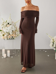 Detail of elegant off-shoulder brown mesh maxi dress with textured ruching and sheer sleeves