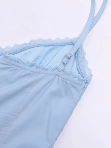 Close-up of light blue dress showing delicate lace trim and adjustable shoulder straps