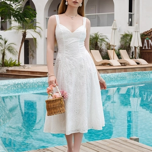 Elegant white V-neck midi dress with floral eyelet embroidery and a-line silhouette