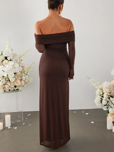Elegant back view of long-sleeve off-shoulder brown floor-length dress with candle decor