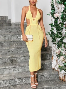 Detail shot of yellow knit dress featuring hollow out waist design and crochet texture