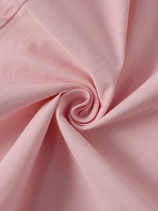 Detailed macro view showing the soft texture and fine grain of the pink tencel fabric