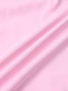 Macro shot of pink chiffon fabric showing smooth texture and elegant diagonal draping