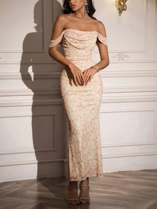 Detail of ruched floral bodycon dress with off-shoulder sleeves and cowl neck design