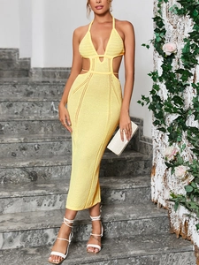 Close-up of yellow knit halter maxi dress featuring deep V-neck and hollow-out waist detail
