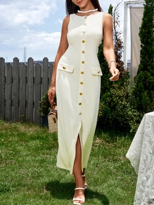 Detail of cream rib-knit dress with front buttons and decorative flap pockets