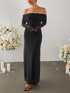 Elegant off-the-shoulder black evening gown with finger-hole sleeves and floor-length detail