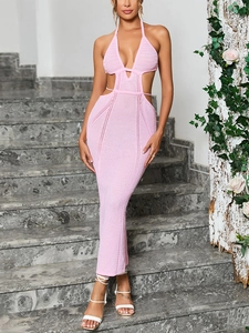 Detail of pink knitted crochet dress featuring side cut-outs and halter neckline texture