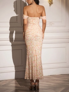 Detail view of floral off-shoulder maxi dress with ruched design and mermaid hemline