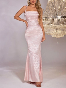 Detail of pink satin jacquard slip dress with floral texture and elegant fishtail hemline