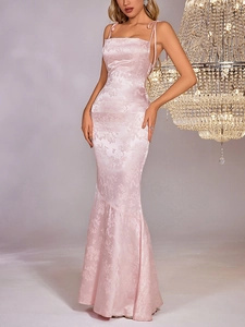 Detail of light pink floral jacquard fabric on a satin fishtail evening dress with straps
