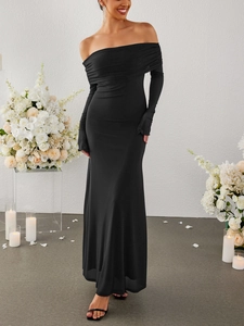 Elegant off-shoulder black maxi dress with long sleeves and sleek bodycon silhouette