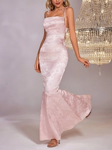 Detailed close-up showing the pink satin jacquard fabric and back lace-up design of the dress