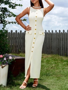 Close-up of ribbed knit dress featuring elegant gold buttons and decorative pocket flaps