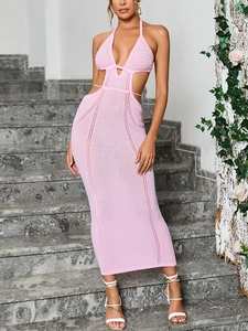 Detailed close-up of pink crochet knit fabric with hollow cut-out design on maxi dress