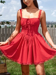 Detail of red backless A-line dress with lace trim and corset style bodice details