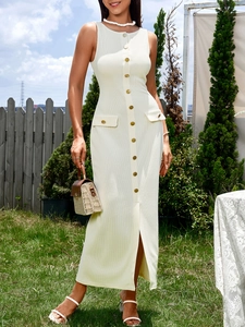 Detail shot of the ribbed texture and button decoration on this beige knit midi dress