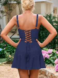Detail of the navy blue dress featuring a lace-up back design and adjustable straps