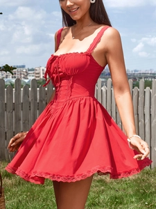 Close-up of the red backless mini dress featuring delicate lace trim and waist lace-up detail