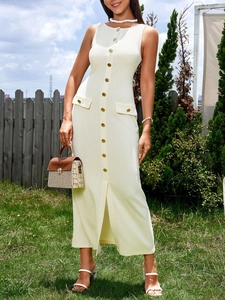 Close-up of white ribbed knit dress featuring a button-down front and side slit detail