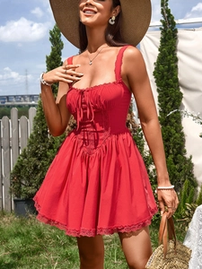 Detail of red A-line dress with lace trim, square neckline, and drawstring details