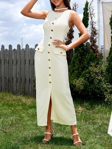 Detailed close-up of ribbed off-white knit dress with button front and side pocket flaps