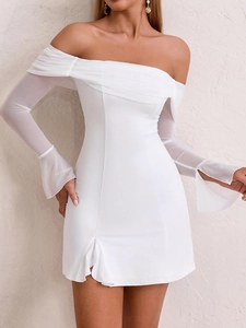 Detail of off-shoulder mesh sleeves and bell cuffs on a white bodycon mini dress