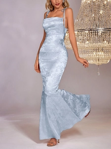 Detail of light blue floral jacquard satin fabric on a backless fishtail maxi dress