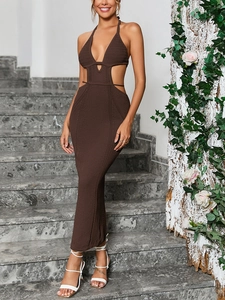 Close-up of crochet knit texture and cut-out waist detail on a brown maxi dress