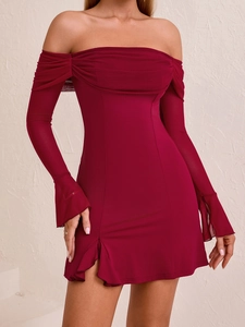 Detail view of burgundy off-shoulder mini dress with ruched mesh sleeves and side slit