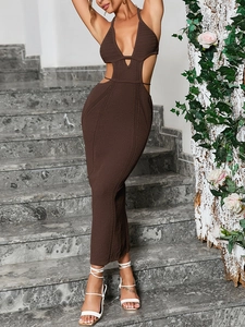 Detail of the knit texture and waist cut-outs on a brown halter neck maxi dress