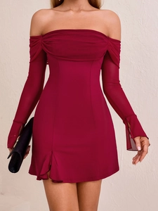 Detail of burgundy off-shoulder mini dress featuring sheer mesh sleeves and ruched neckline