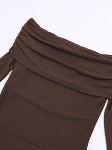 Detail of off-the-shoulder neckline with ruched brown mesh fabric on long sleeve dress