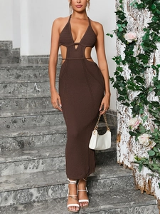Close-up of dark brown crochet knit dress featuring halter neck and waist cut-out details