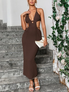 Detail of the brown crochet knit texture and side waist cut-out of the backless maxi dress