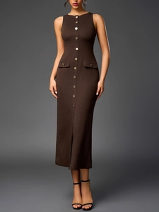 Detail view of brown ribbed knit dress with front metal buttons and a stylish slit hemline